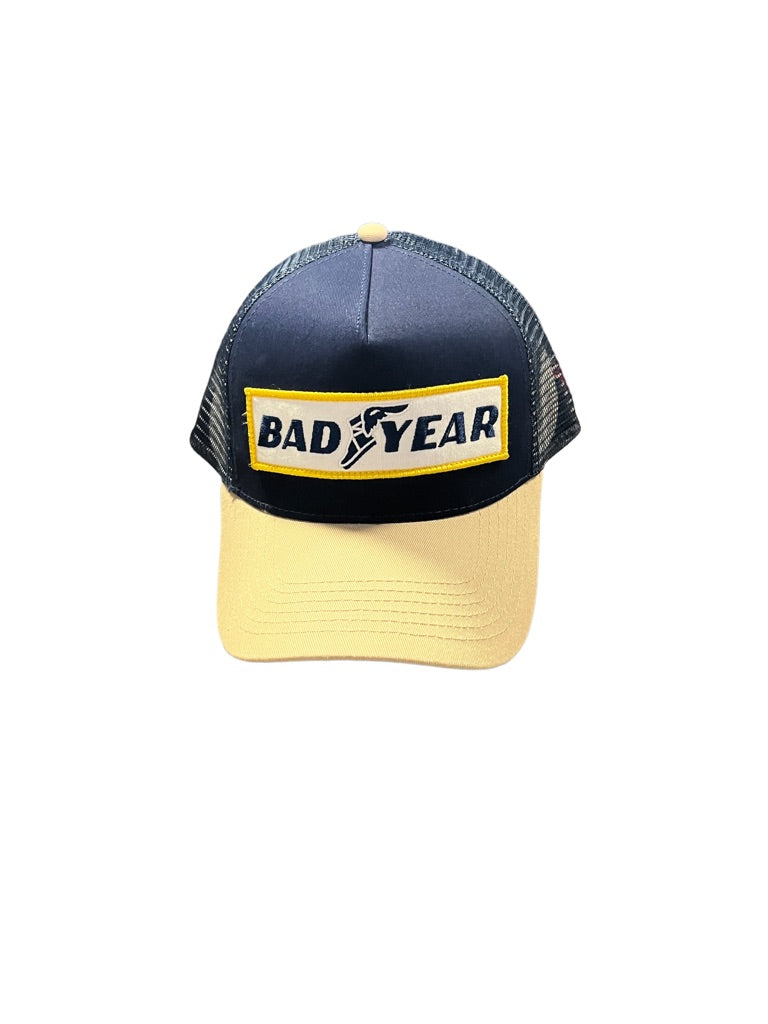 Bravest Studios Trucker Hat Navy and Tan Bad Year